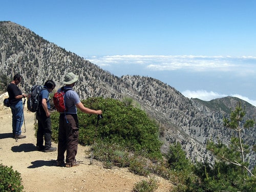 photo-of-hiking-on-the-ridge-of-a-mountain